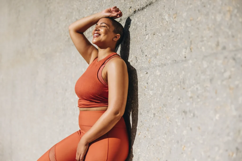 Woman leaning against wall